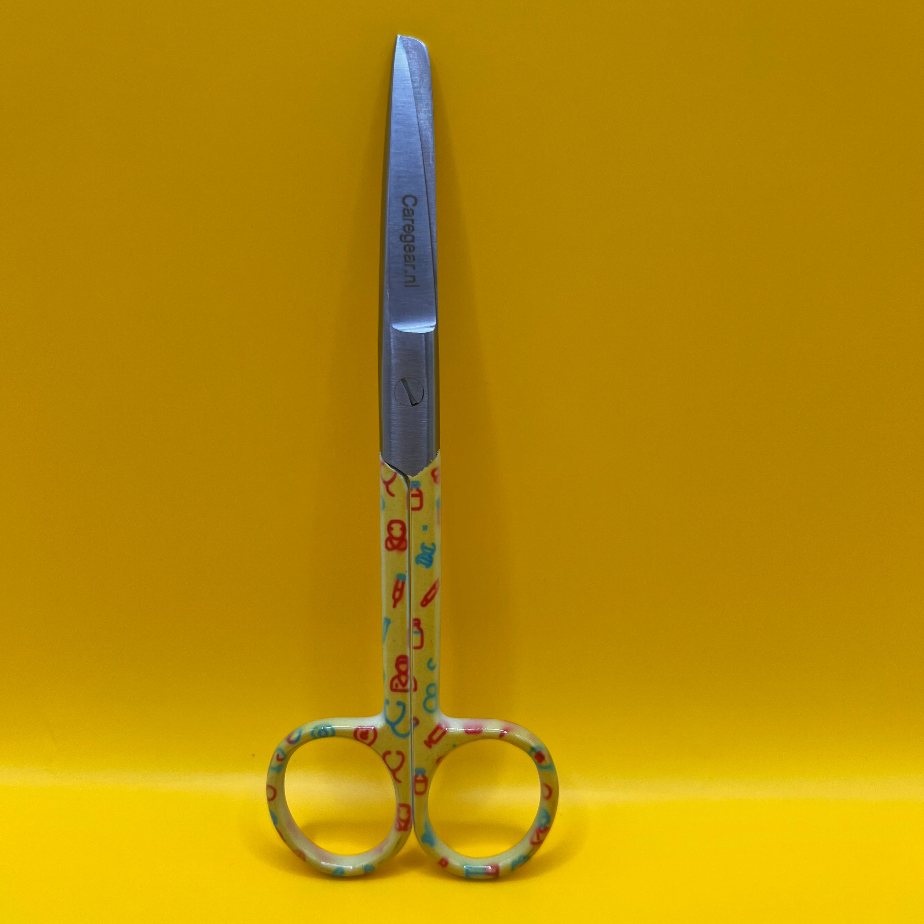 Gele set met zorg iconen - Caregear.nl Zorg scharen verpleegkundigen